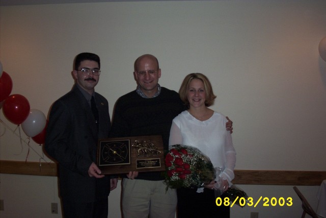 March 2003 - Annual Banquet: Chief Christopher Taylor with 2002 Firefighter of the Year Andrew G. McFadden and his wife Katrina