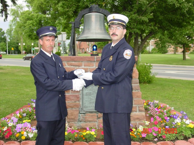 July 2005 - FF Wayne Andrus is presented his ring by Chief Taylor for 25 years of consecutive service