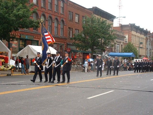 July 2005 - Color Guard leading the way as Potsdam Firefighters march down Market Street during Annual Review