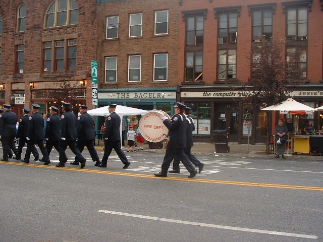 July 2005 - Potsdam Firefighters A.J. Mason and  Conor Corbett keep the beat during the Annual Review parade