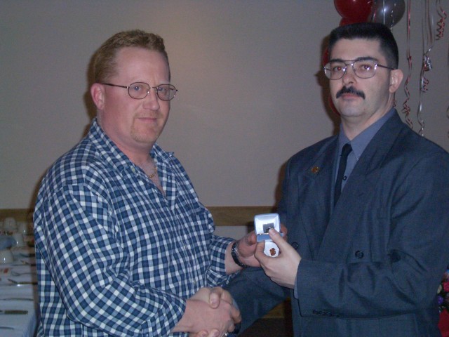 February 2004 - Assistant Chief Kevin Grant presented his ring for 25 years of consecutive service by Chief Taylor