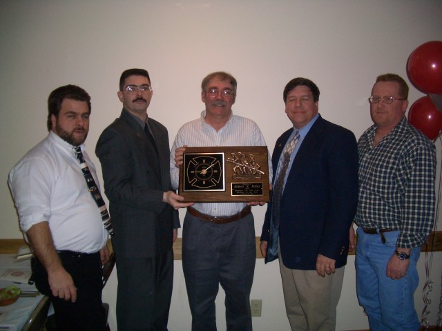 February 2004 - Annual Ladies Night Banquet - Past Chief Robert Robar (center) presented 2003 Firefighter of the Year Award