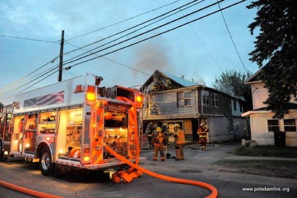 Engine 49 operating at a structure fire on Pine Street.