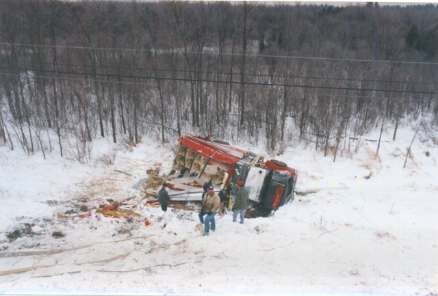 January 1995 - Engine 80 at the bottom of the embankment on USH 11 after attempting to avoid a head on collision that occurred in front of them while returning from a fire in Canton