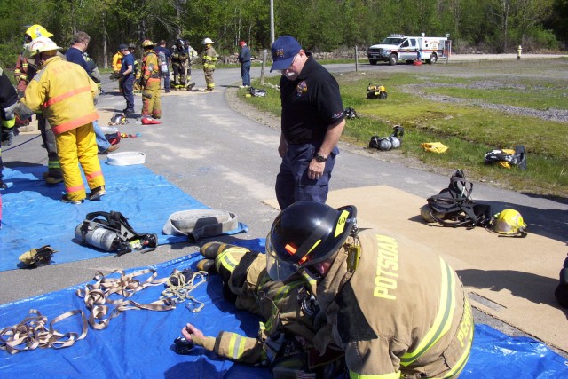 May 2005 - Potsdam Firefighters completing an evolution under the watchul eye of Deputy Chief &quot;Butch&quot;Cobb at the Mayday, Mayday- Firefighter Down training at the George E. Briggs Training Center In West Potsdam