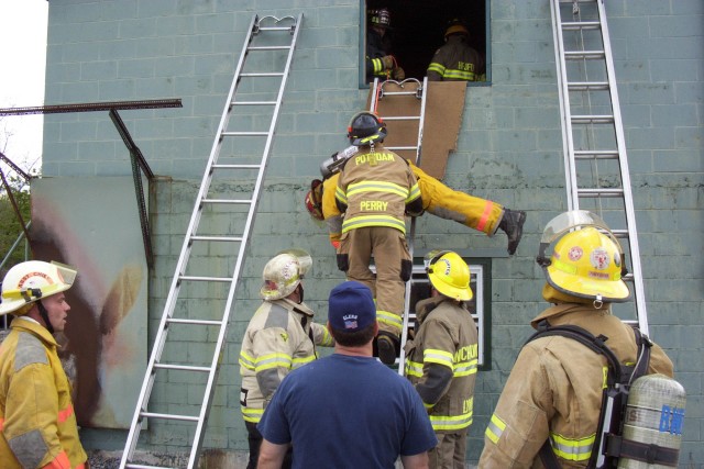 May 2005 - Lieutenant Perry removing a City of Ogdensburg firefighter from the smoke tower at the Mayday, Mayday- Firefighter Down training at the George E. Briggs Training Center In West Potsdam