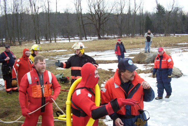 February 2006 - Chief Taylor discussing the ice rescue with Dive Master Mark Smutz before entering the icy water.