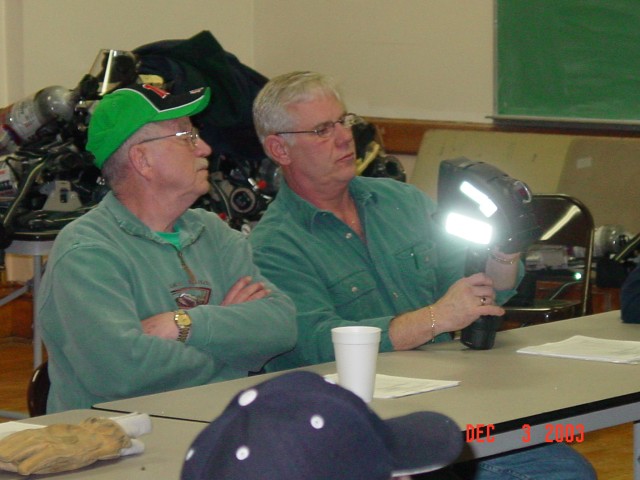 December 2003 - FF Al Grant and FF Walt McLennan look over the new thermal imaging camera during the classroom portion of the training